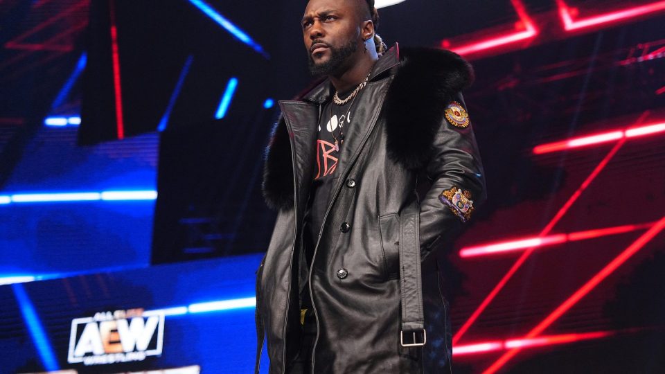 Swerve Strickland making an entrance during AEW Dynamite whilst wearing a black leather jacket.