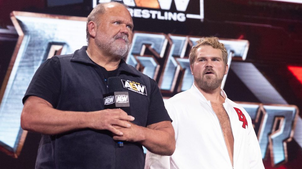 Arn Anderson (left) and Brock Anderson (right) on the stage during AEW Collision
