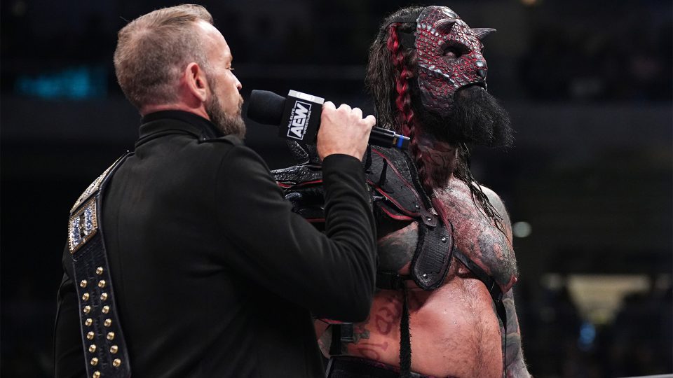 Christian Cage (left) talking to Luchasaurus (right) on AEW Dynamite