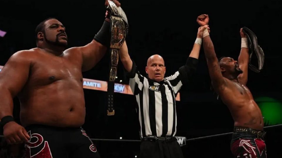 Swerve In Our Glory Keith Lee and Swerve Strickland celebrate as AEW World Tag Team Champions AEW Fyter Fest 2022