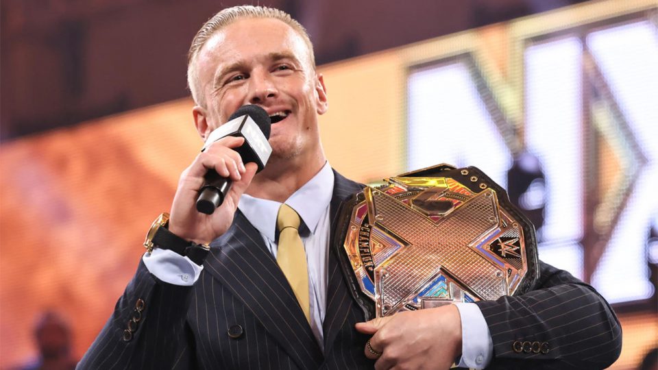 Ilja Dragunov holding the NXT Championship