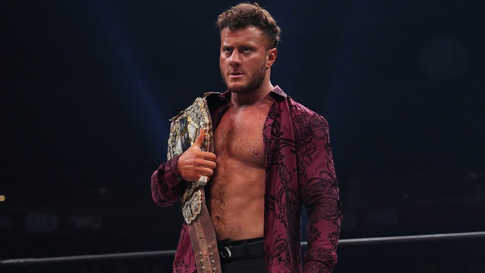 MJF holding the AEW World Championship in an AEW ring