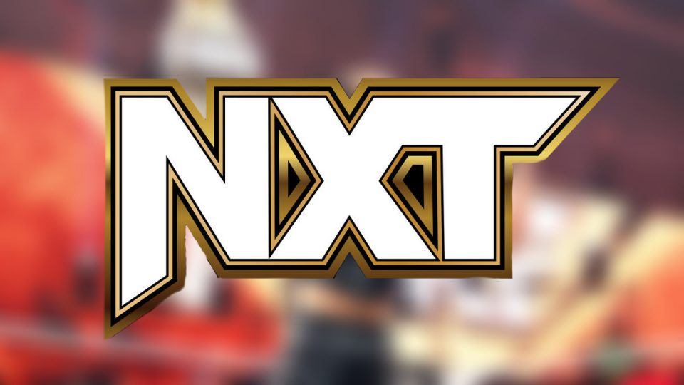 NXT logo over blurred background
