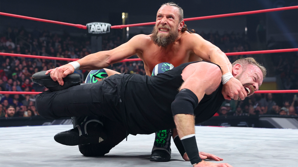 Bryan Danielson locking in a submission on Christian Cage